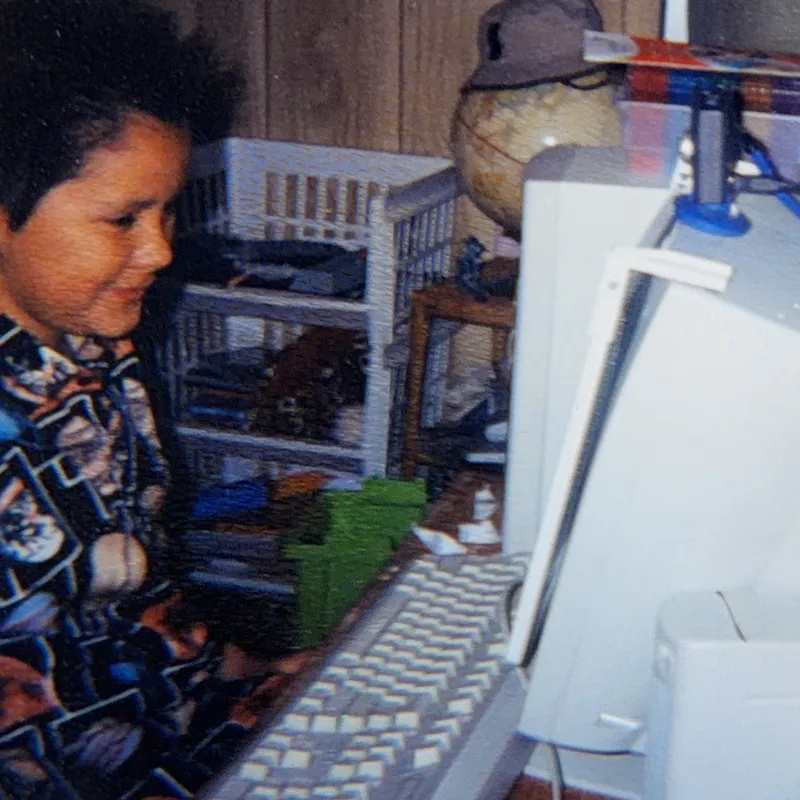 Casey as a child at an early computer